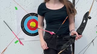 🏹 Deep in the woods of Barefoot Bushcraft, the air stills as she draws her recurve.