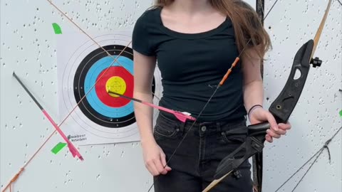 🏹 Deep in the woods of Barefoot Bushcraft, the air stills as she draws her recurve.