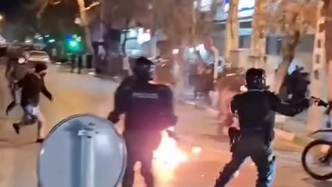 Iranian Security Forces Set Alight by Firebomb