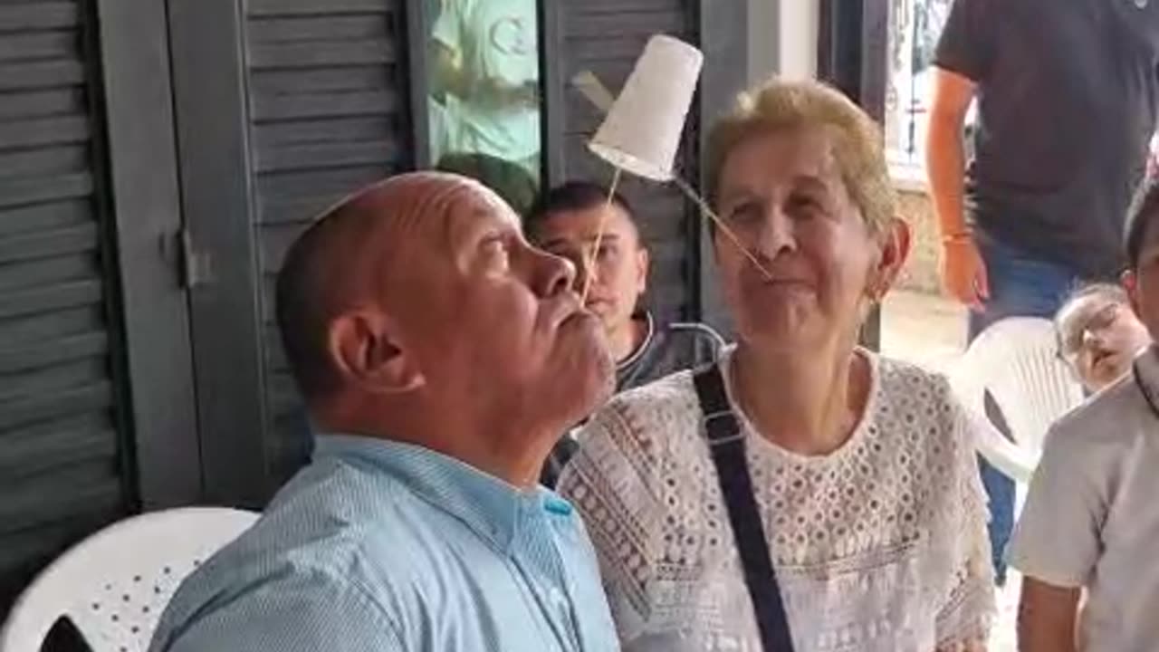 Grandma Trying Her Best at a Cup Game