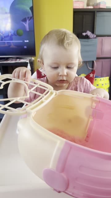 kayla playing with her toy dog — so focused!