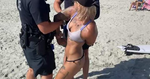 COPS HANDCUFF AND DETAIN WOMAN FOR WEARING A THONG ON THE BEACH❗
