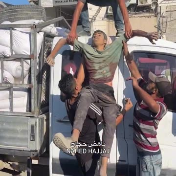 Martyrs waiting for aid loaded onto trucks arrived at Shifa hospital after being shot