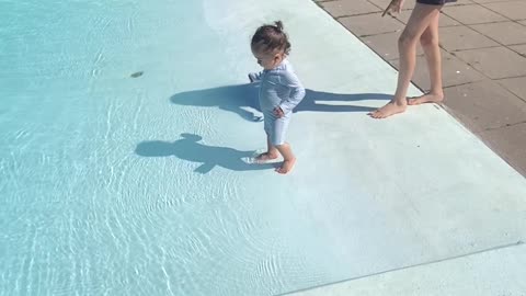 Baby's First Dip In the Pool