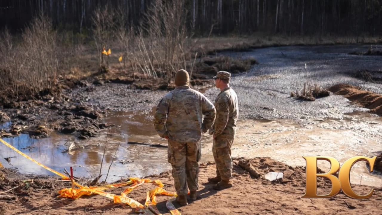 US and Lithuanian forces struggle to drain swamp to recover 4 soldiers in submerged armored vehicle