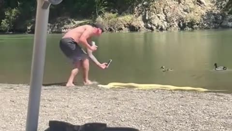 guy took his pet snake to the river