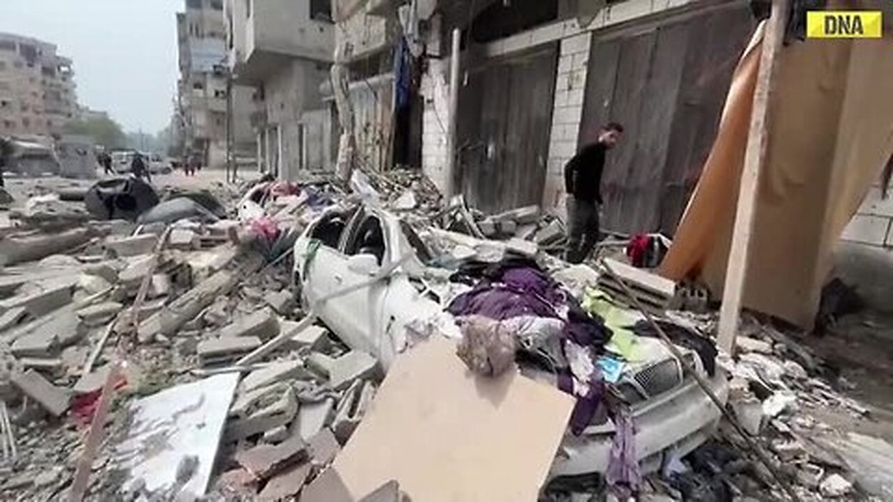 Israel_Hamas_War__Palestinians_in_Gaza_s_Jabalia_Survey_Destruction_After_Israeli_Airstrike