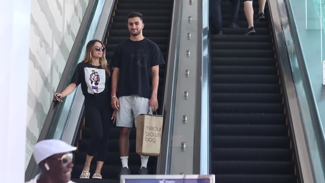 ouching Hands on the Escalator.