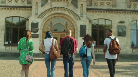 Students walking into the University