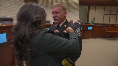 Honoring firefighters' dedication and new leadership at the badge pinning ceremony.