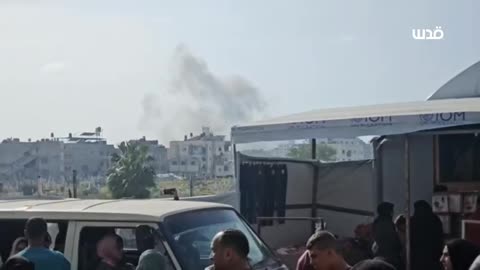 Israeli fighter jets bombard a residential building in the Al-Sena'a area west of Gaza City.