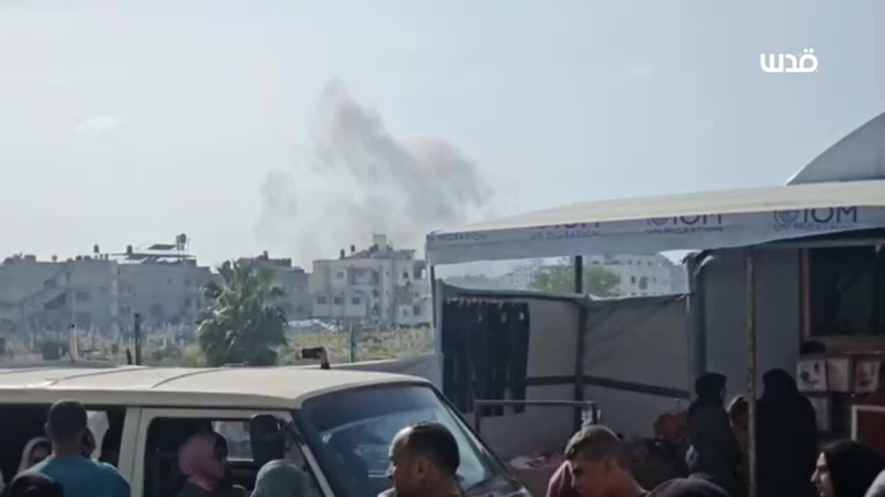 Israeli fighter jets bombard a residential building in the Al-Sena'a area west of Gaza City.