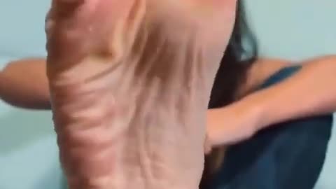 Close up woman scrunching her soles
