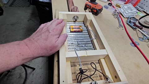 Putting some finishing touches on the washboard guitar before I send it out to the client.