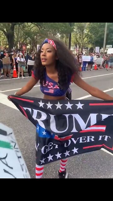 Racist liberal protestors harrass black female Trump supporter