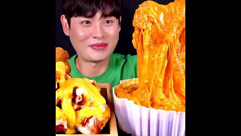 Honey mustard fried chicken, fried onion rings, spicy rice cakes with super thick cheese