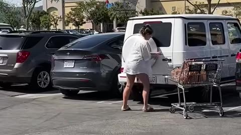 Man Catches woman breaking into his car