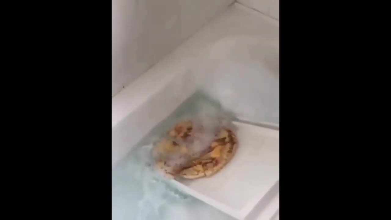 Pizza swimming in bathtub