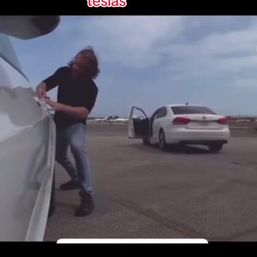 Dumbass Liberal loses Car as he decides to hump, scratch his butt on and Vandalize a Tesla