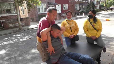 Luodong Massages Skinny Man On The Sidewalk With The Women Watching