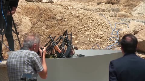 Kurdish PKK militants burn weapons, beginning disarmament