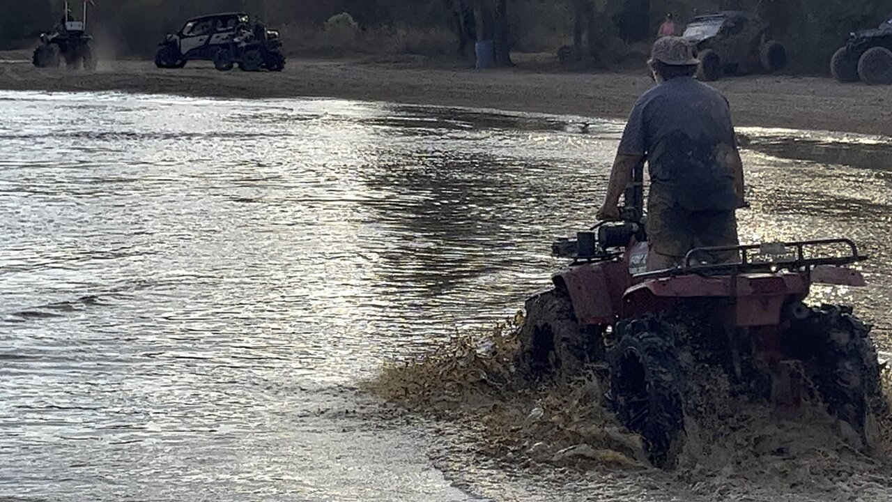 Mudaholic 2025 Layton playing in water