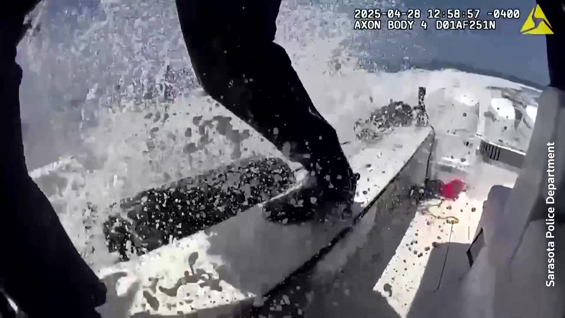 Florida police officer leaps onto runaway boat