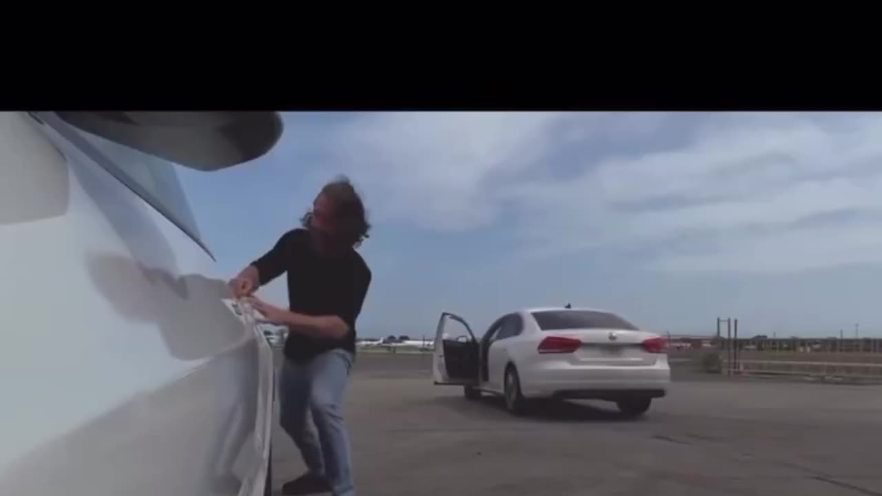 Idiot fails to put his car in park, assaults a Tesla, rubs his naked bum, then chases HIS car