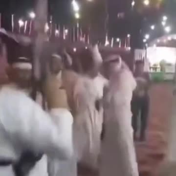 An Arab dancing & shooting his AK-47 & completely OBLIVIOUS as he SHOOTS his fellow Arab.