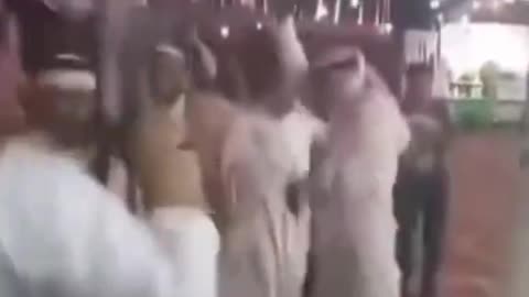 An Arab dancing & shooting his AK-47 & completely OBLIVIOUS as he SHOOTS his fellow Arab.
