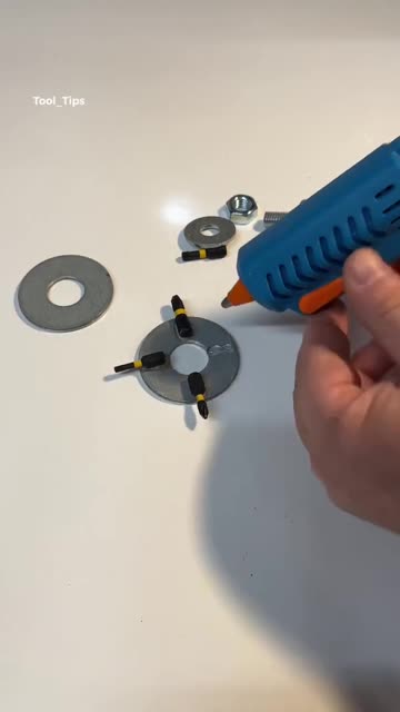 Hands Working on DIY Tool Modification with Washer and Bits