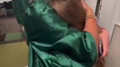 Little sister gets emotional seeing her big sister graduate high school