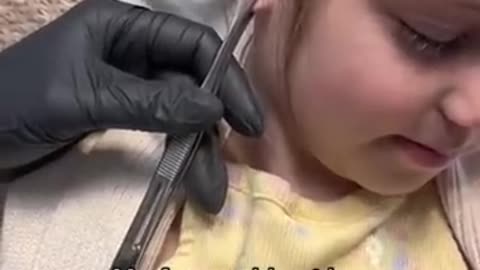 SHOCKING reaction to getting her ears pierced.. #shorts