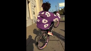 Absolute Human Garbage Terrorizes Pedestrians With His Bike While Doing A Wheelie