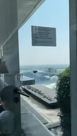 High-rise building rooftop swimming pool in Thailand shakes violently after a massive earthquake...