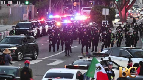 LA police make mass arrests as protesters defy overnight curfew