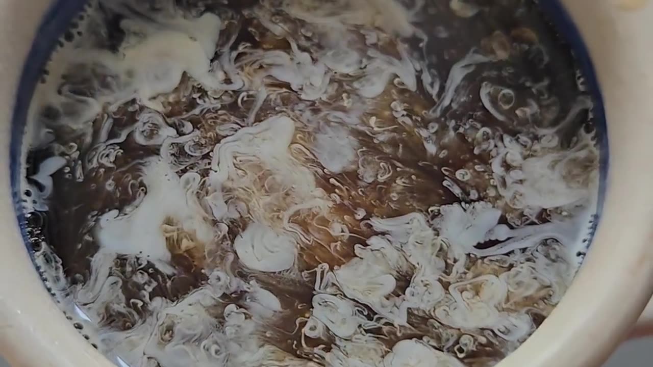 Mesmerizing Cream Dispersal In Coffee