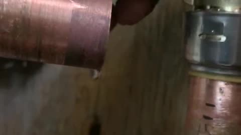 Putting on a shark bite elbow joint onto 1 inch copper pipe for water