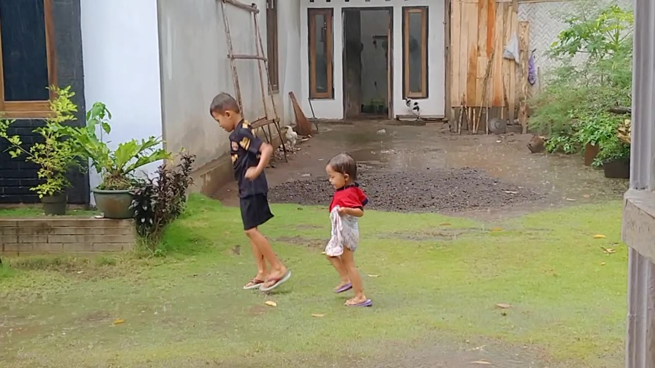 Two Children play with rain