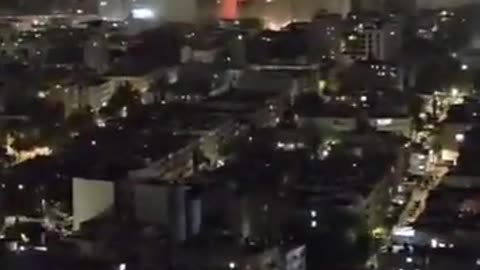 Smoke seen rising from the site of a direct impact near Tel-Aviv in Central Israel