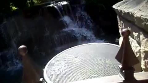 Little waterfall by hotel rooms