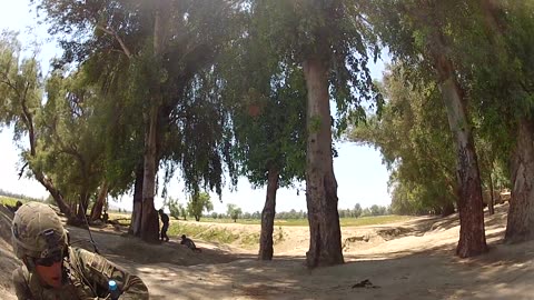 US Soldier moving during intense fire fight.