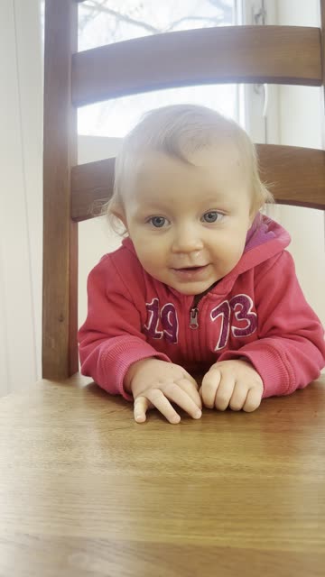 Baby Kayla Hiding Behind a Chair – Too Cute!