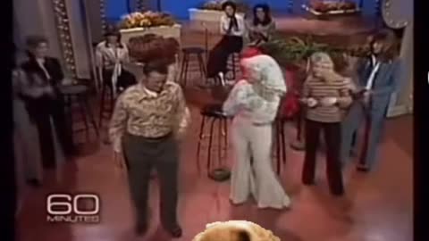 Dolly Parton watches a video of her singing with her parents. from like 30 years ago