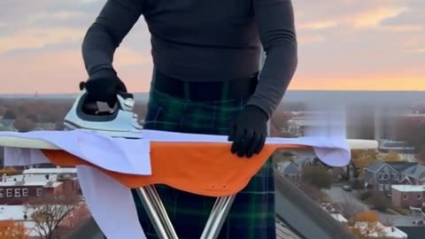 LEVI EXTREME IRONING ON TOP OF A CHURCH