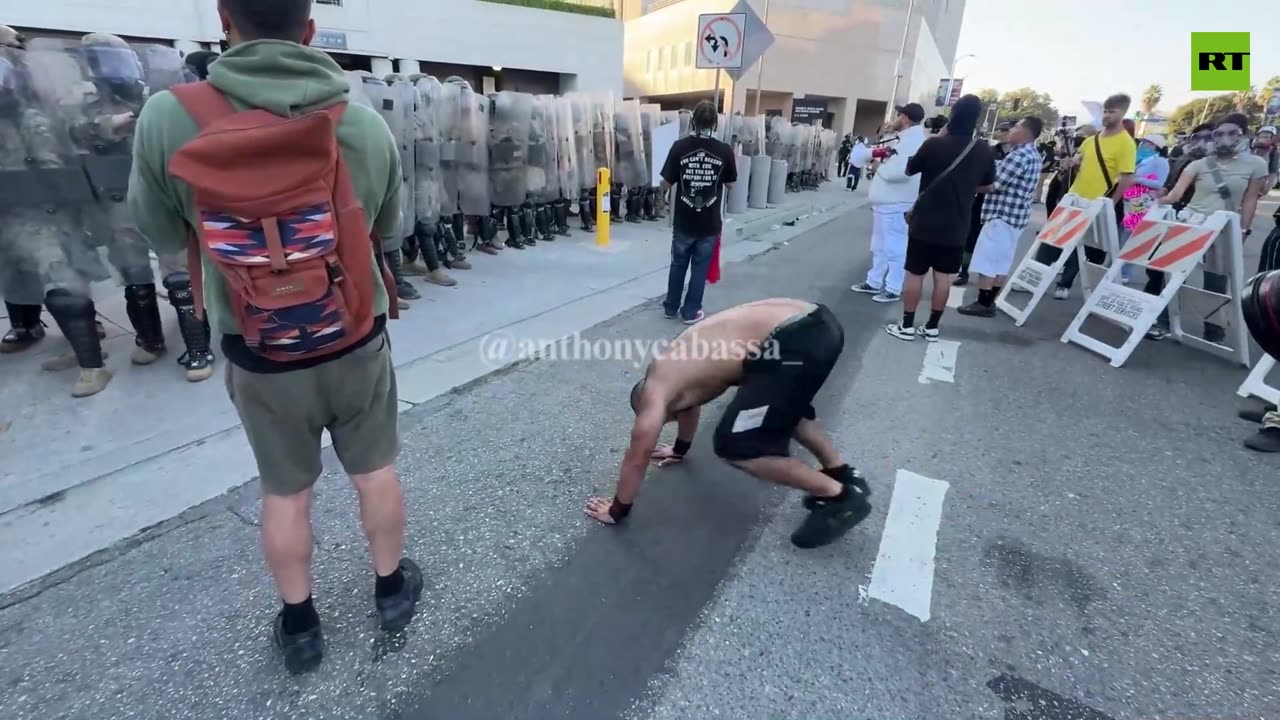 Hairy ICE protester taunts LA Marines with push ups