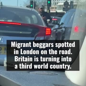 Locals spot migrant beggars on the road in North London.