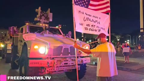 NOW: Anti-Trump Protester FACES OFF with National Guard's armored vehicles