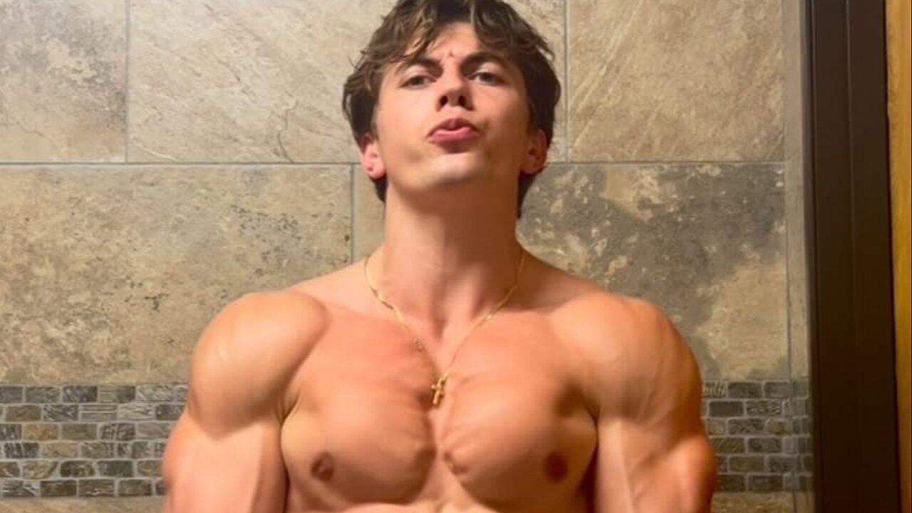 Young man flexing muscles