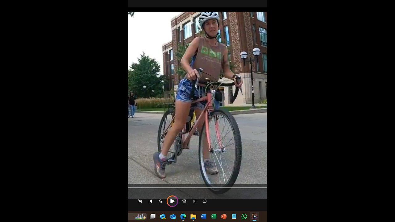 Woman bicyclist unhappy with our sign